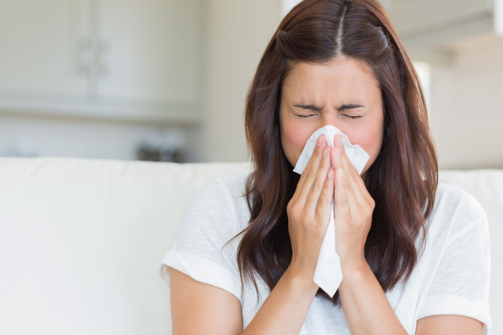 Woman Sneezing Because of Dirty Carpets